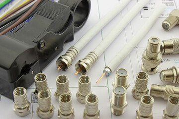 Metal F-connectors for connecting coaxial cable. Close-up. Soft focus.