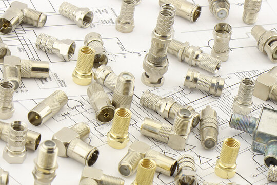 Metal F-connectors for connecting coaxial cable. Close-up. Soft focus.