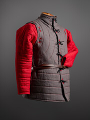 Historical fashion. Medieval knight cloth. Padded jacket gambeson.