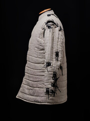 Historical fashion. Medieval knight cloth. Padded jacket gambeson.