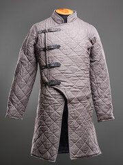 Historical fashion. Medieval knight cloth. Padded jacket gambeson.