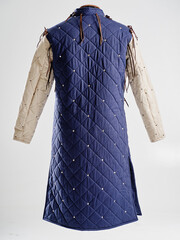Historical fashion. Medieval knight cloth. Padded jacket gambeson.