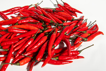 Red hot peppers on white background. Hot capsicum. Fresh hot pepper pods
