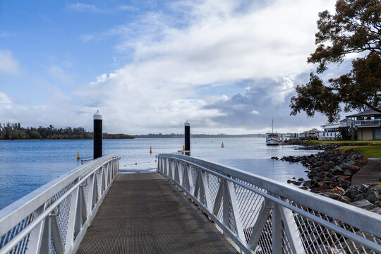Pontoon and riverside views over water of coastal Hastings river in Port Macquarie