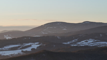 Colorful sunset over the Czech countryside. View of the Krkonoše mountains from the...
