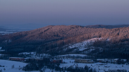Colorful sunset over the Czech countryside. View from Mount Žaltman - the highest mountain in the...
