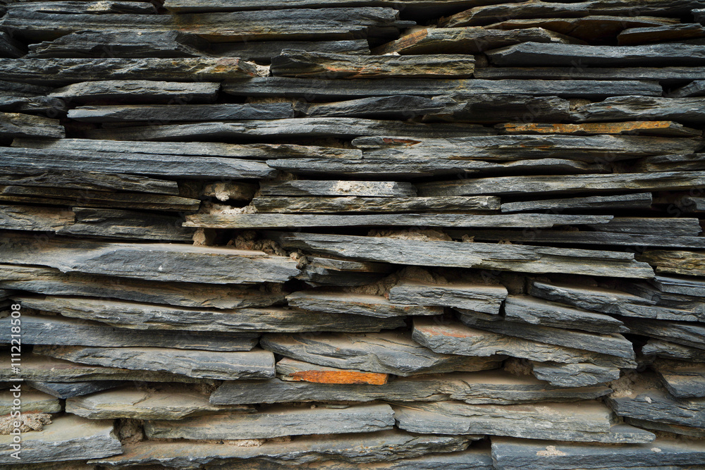 Wall mural Close up of the wall of Paiwan People's Slate House in Taiwan Scenic Area of China Ethnic Museum