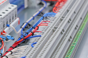 Connection of electrical modules using insulated mounting wires. Close-up. Soft focus.
