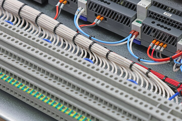 Connection of electrical modules using insulated mounting wires. Close-up. Soft focus.