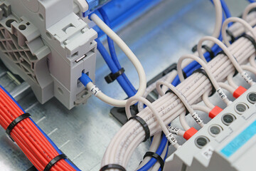 Connection of electrical modules using insulated mounting wires. Close-up. Soft focus.