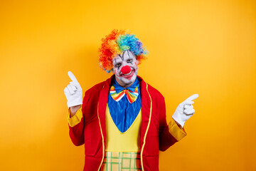 Smiling clown pointing, vibrant yellow background, fun.