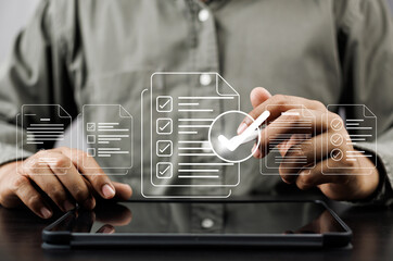 Business performance monitoring and evaluation concept, Take an assessment, Business man using laptop and tablet online checklist survey, Filling out digital checklist, Questionnaire with checkboxes.
