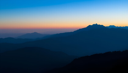 Fototapeta premium Layered mountain silhouettes at dusk, with gradient shadows fading into the horizon, creating depth and a sense of vastness.