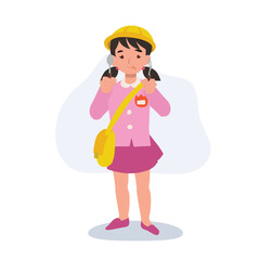 joyful kindergarten girl in uniform eating and showing joy with fork and spoon