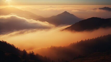 Naklejka premium A serene sunrise scene with a mountain range shrouded in mist and fog filling the valley below