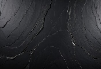 Dark slate stone is a deep, rich material with a cool, almost mysterious allure. Its surface is smooth yet subtly textured, revealing fine layers that catch the light in delicate, muted reflections