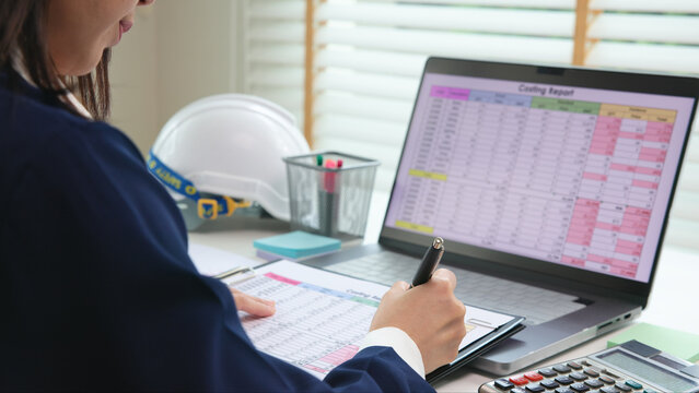 Expert woman asian female people review data number costing managerial account prepare monthly actual cost variance report at tax audit office. ESG sheet budget control ERP process service project.