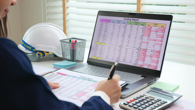 Expert woman asian female people review data number costing managerial account prepare monthly actual cost variance report at tax audit office. ESG sheet budget control ERP process service project.