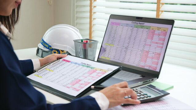 Expert woman asian female people review data number costing managerial account prepare monthly actual cost variance report at tax audit office. ESG sheet budget control ERP process service project.