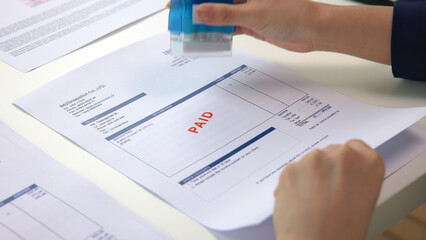 Worker busy work seal getting paying symbol on sales bill form report paper stack. Pay off full amount income tax fee past due date sale office job task. Cash flow debt credit loan risk control budget