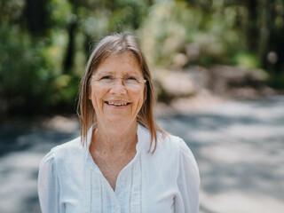 Portrait of senior woman enjoying a healthy lifestyle in nature
