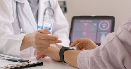 Close-up GP advice AI smart IoT watch guide to patient help collect ECG data, pulse heart rate, blood pressure, wrist sensor sport solution record connect to clinic health device digital platform app.
