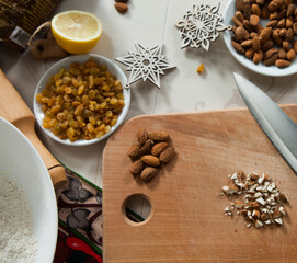 hands of a woman preparing biscuits or cakes in the kitchen
