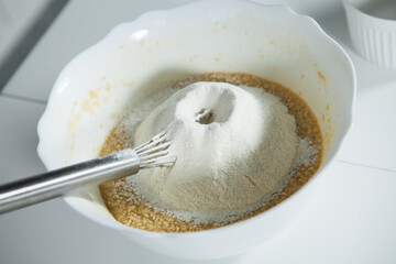hands of a woman preparing biscuits or cakes in the kitchen
