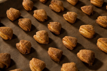 hands of a woman preparing biscuits or cakes in the kitchen