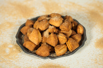 hands of a woman preparing biscuits or cakes in the kitchen