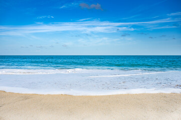 A beautiful blue ocean with a white foam line
