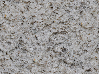 Textured rough grain cement wall background as exterior of building, Close-up of an unsmooth cement texture, perfect for adding a raw, industrial feel to your design projects