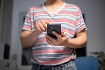 Accountant working at home at night, casual financial investment on a calculator, calculating, analyzing business and marketing growth on various financial document data graphs.