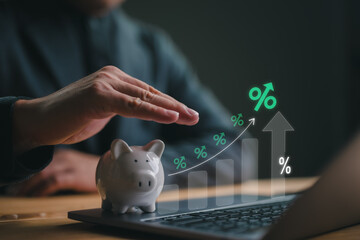 Businessman hand on piggy bank with growth up arrow, saving money wealth and financial concept,...