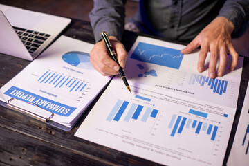 Accountants working on financial investments on calculators, calculating, analyzing business and...
