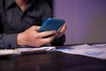 Accountants working on financial investments on calculators, calculating, analyzing business and marketing growth on graphs of various financial documents.