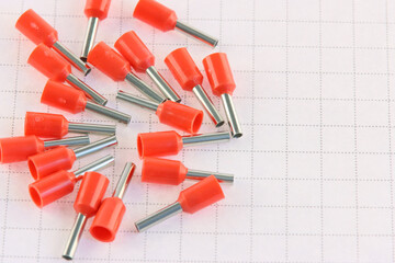 Copper pin colored insulated tips. Close-up. Soft focus.