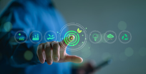 Net-zero and carbon-neutral concept. Businessman touch on virtual screen Net Zero icons, renewable...