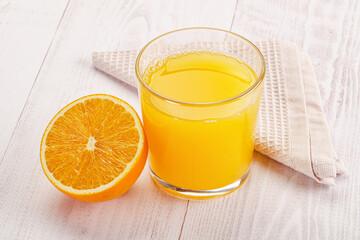 Sweet fresh orange juice in the glass