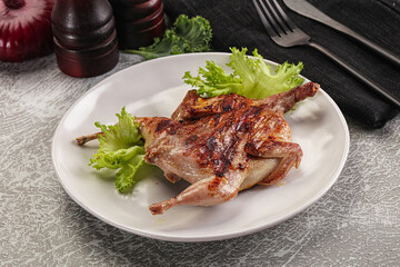 Grilled quail in the plate