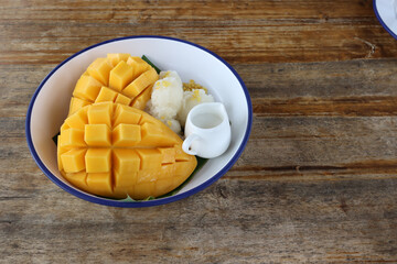 Mango sticky rice is a traditional Southeast Asian and South Asian dessert made with glutinous rice, fresh mango and coconut milk