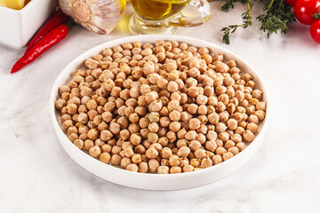 Dry chickpea seeds heap in the bowl