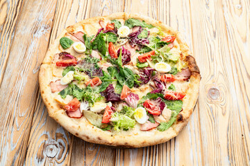 Italian pizza caesar with eggs salad chicken tomatoes and mozzarella photography. top view