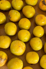 Fresh yellow persimmon fruit