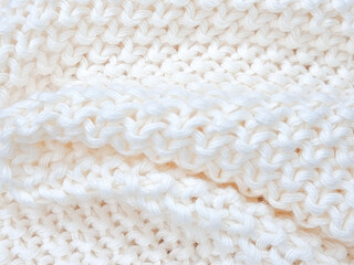 A cozy white knitted plaid background with soft, minimalist details and woven charm.