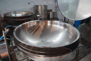 Large stainless steel pot designed for group feeding