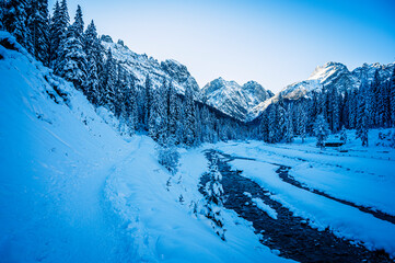 Obraz premium Ice Dawn in Sappada. Walk through ancient villages and dream mountains. Dolomites.
