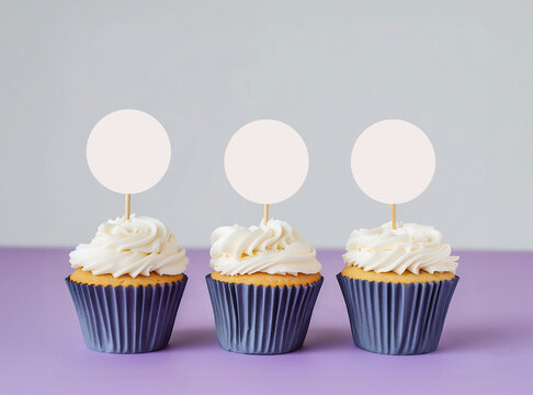 Simple Vanilla Cupcake Mockup with Blank Round Toppers, White Frosting, and Bokeh Lighting – Perfect for Event Design and Baking Photography