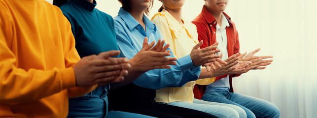 Fototapeta premium Group of startup company employee gather in line at corporate event to applaud achievement and celebrate company's success or business presentation meeting with audience in panorama banner. Synergic