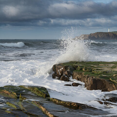 Ocean coast: waves crashing on rocks, sea breeze